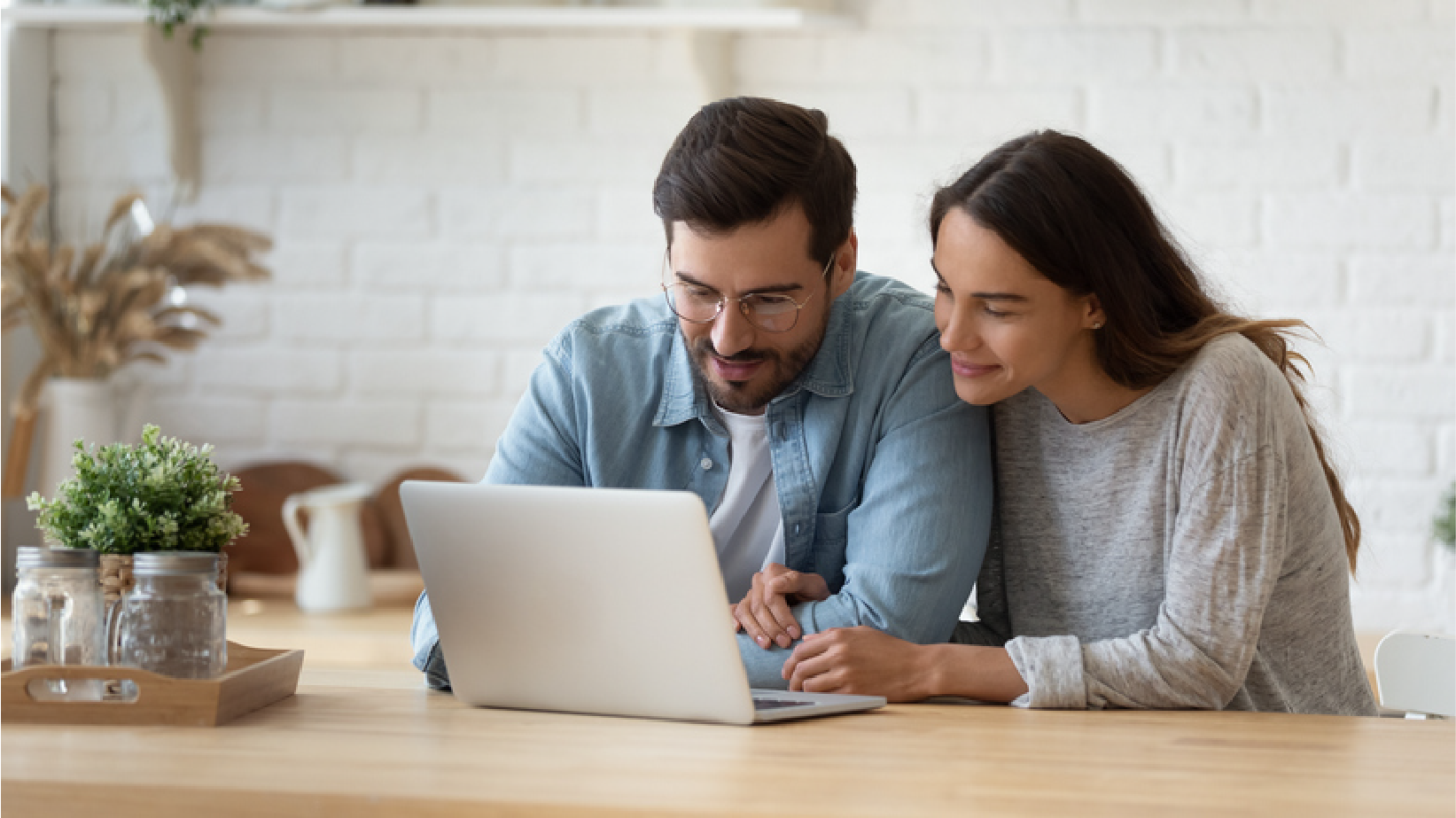 couple looking at computer | Pro Comfort Heating & Cooling