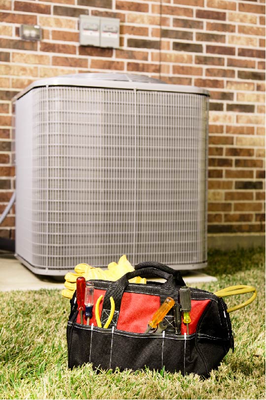 Hvac unit and tool bag outside home